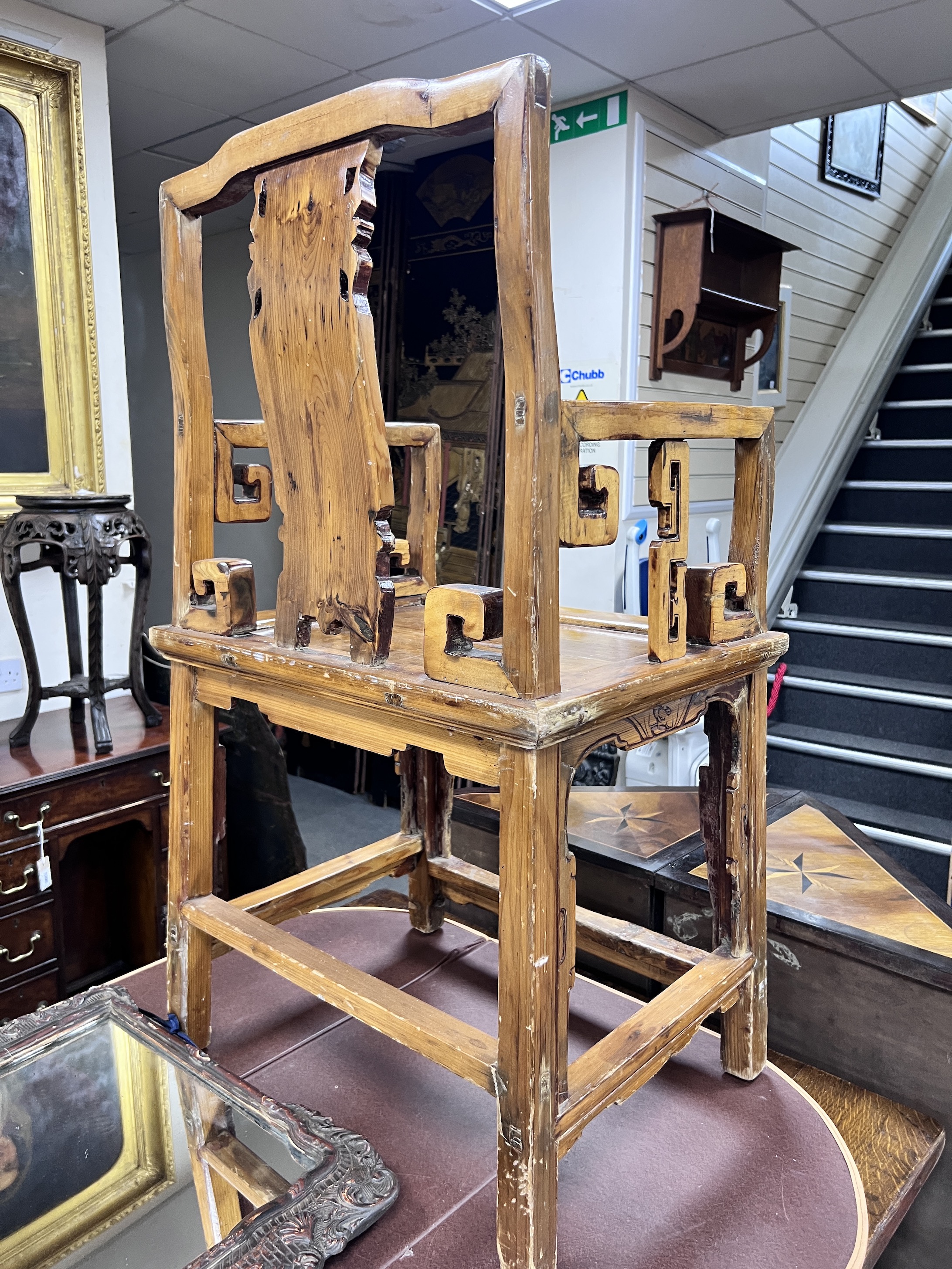 A Chinese carved pine armchair, width 57cm